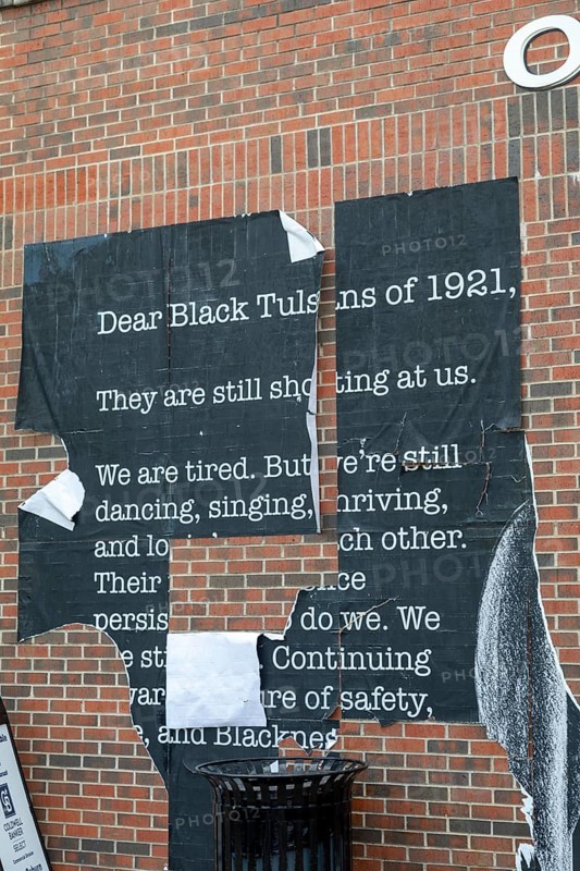 Tulsa, Oklahoma, A defaced poster in the Greenwood District, known as the Black Wall Street. The district was burned to the ground with many African-Americans killed in the 1921 Tulsa race massacre