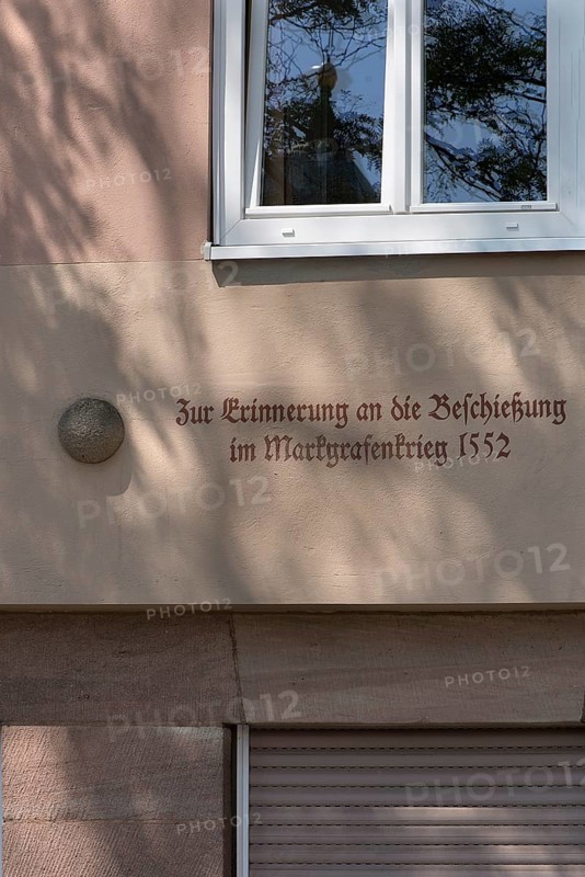 House sign, cannonball from the Margrave's War 1552, Egidienplatz 15, Nuremberg, Middle Franconia, Bavaria, Germany, Europe