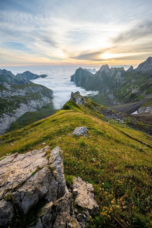 View over Säntis mountains into the valley of Meglisalp at sunrise, Rotsteinpass, high fog in the valley, Säntis, Appenzell Ausserrhoden, Appenzell Alps, Switzerland, Europe