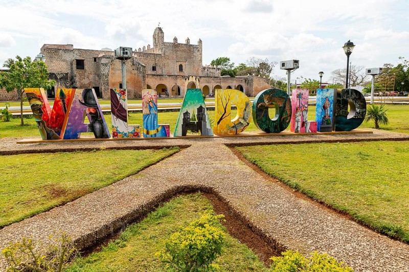 Colourful lettering sign for Valladolid, Yucatan, Mexico in front of Convent of San Bernardino of Sienna