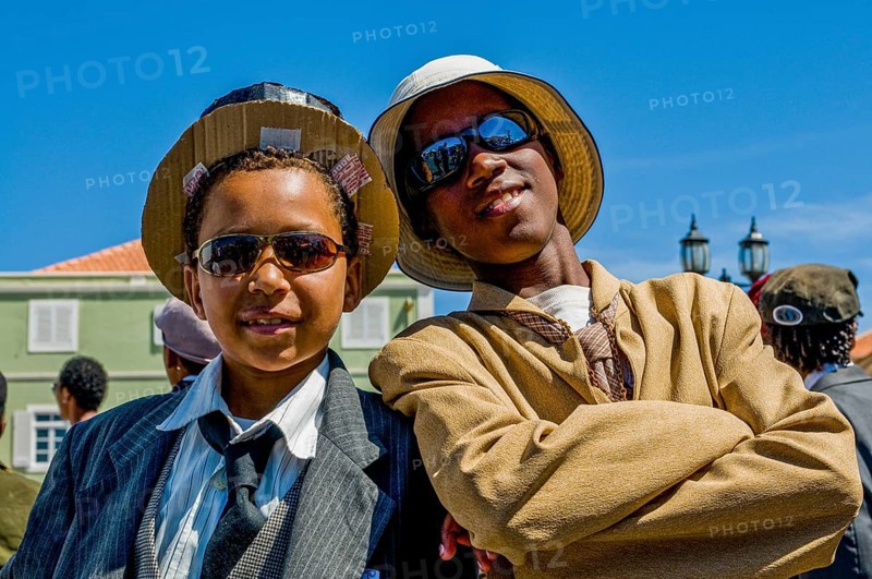 Young men, dressed as businesspeople. Carnival. Mindelo. Cabo Verde. Africa