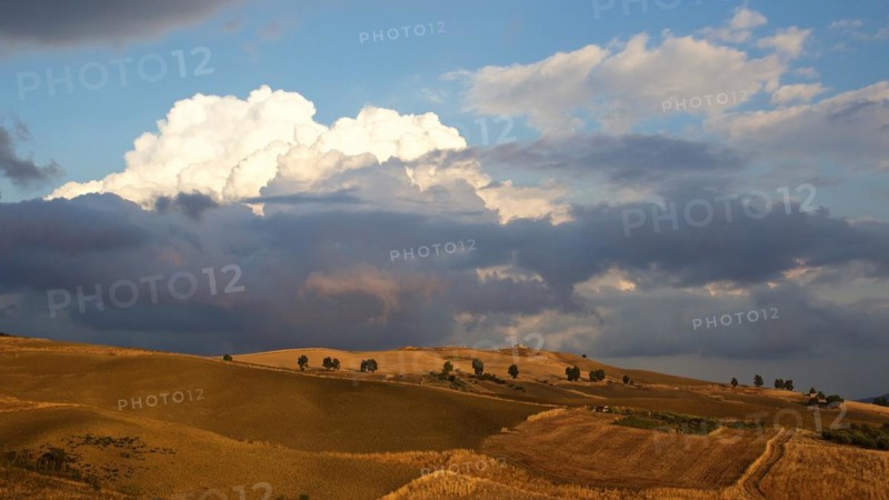 Evening light, Autumn hill landscape, brown fields, dramatic cloudy sky, Madonie National Park, Autumn, late summer, Sicily, Italy, Europe