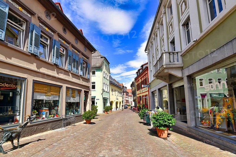 Ladenburg, Germany, July 2020: Mains trees with shops in historical city center dating back to Middle Age of small German town Ladenburg on sunny summer day, Europe