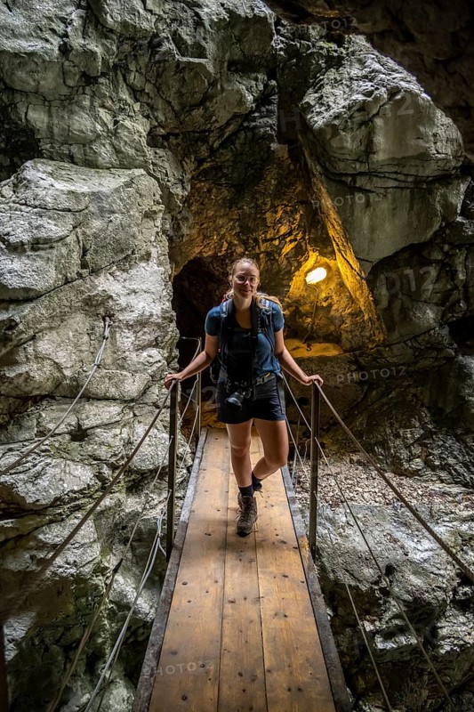 Hiker in a tunnel, Hammersbach flows through Höllentalklamm, near Garmisch-Partenkirchen, Werdenfelser Land, Upper Bavaria, Bavaria, Germany, Europe