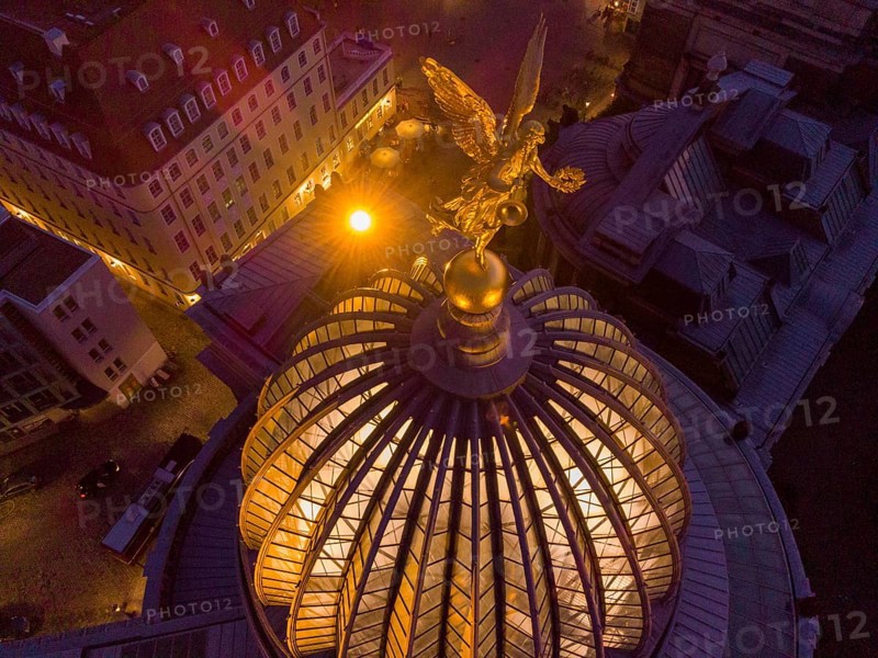 Dresden's old town from above.The glass dome of the Academy of Arts, crowned by a Fama figure, under which there is an exhibition room, called a lemon squeezer after its shape