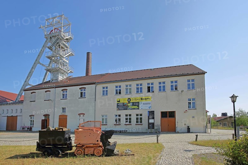 Lorries with winding tower at the former mine Reiche Zeche Fundgrube Himmelfahrt, TU Bergakademie, UNESCO Montanregion, historical, Hunt, Lore, tracks, symbol, colliery, mining, industry, ore mine, factory plant, factory site, technical, university, Freiberg, Saxony, Germany, Europe