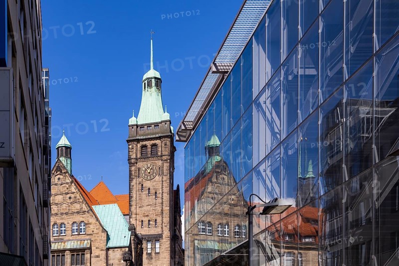 View through Bretgasse to the town hall with the reflection in Galeria Kaufhof