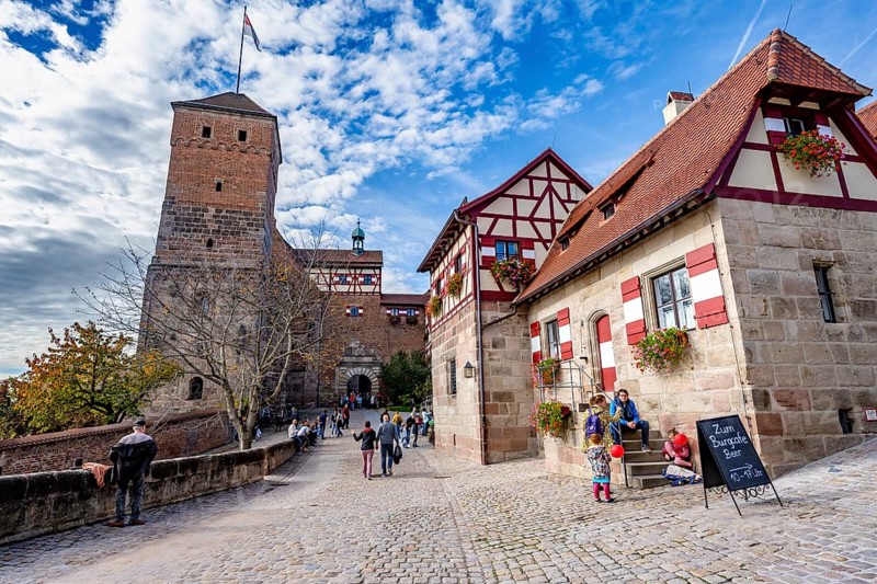 Imperial castle with well house and pagan tower, half-timbered houses in the castle, in autumn, Nuremberg, Middle Franconia, Bavaria, Germany, Europe