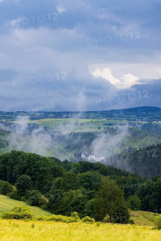 Scharfenstein Castle seen through the rain and fog