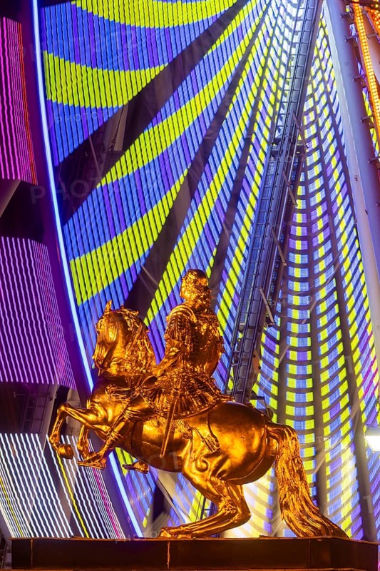 Neustädter Markt is home to one of Dresden's alternative Christmas markets. An illuminated Ferris wheel turns behind the Golden Rider