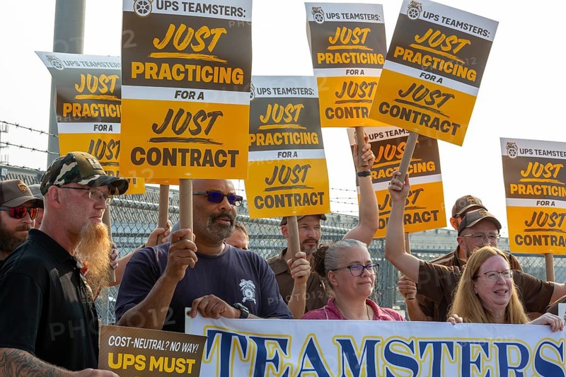 Livonia, Michigan USA, 30 June 2023, Members of the Teamsters Union carried just practicing picket signs at United Parcel Service's Livonia terminal a month before the union's contract covering nearly 350, 000 workers expires.