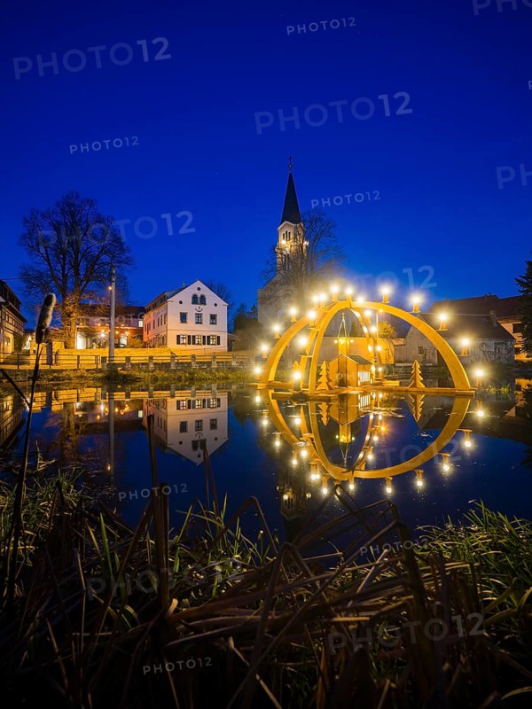 Floating candle arch in the village pond of Bärnsdorf near Moritzburg. The arch is 4.5m high, almost 8m wide and was built by local craftsmen as a special decoration for the local Christmas market
