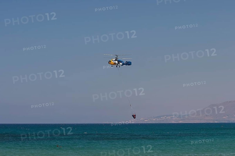 Helicopter, helicopter, fire-fighting helicopter, fire, helicopter close above the water surface, Georgioupolis, Crete, Greece, Europe
