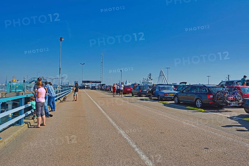Den Helder, Holland, North Netherlands, August 2019: Cars and people waiting to board ferry to island Texel