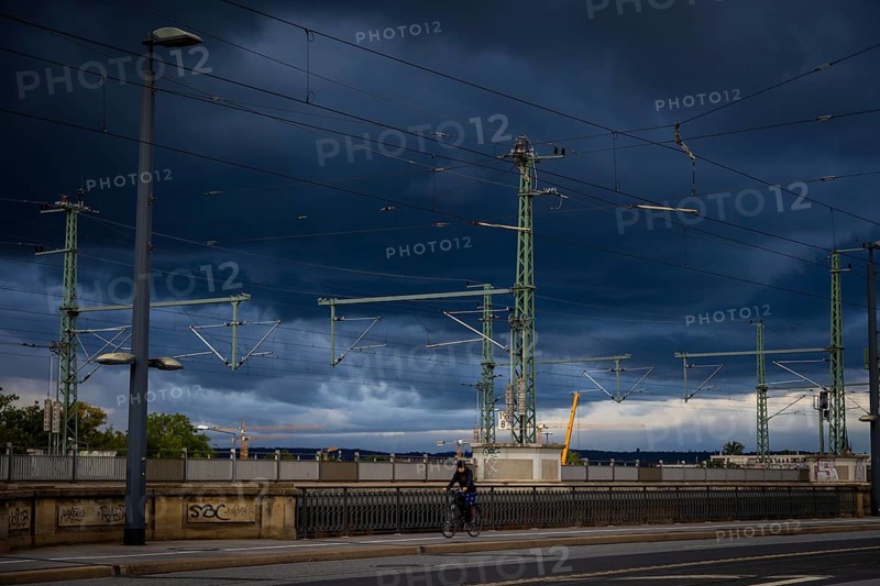 Marienbrücke with stormy sky and cyclists