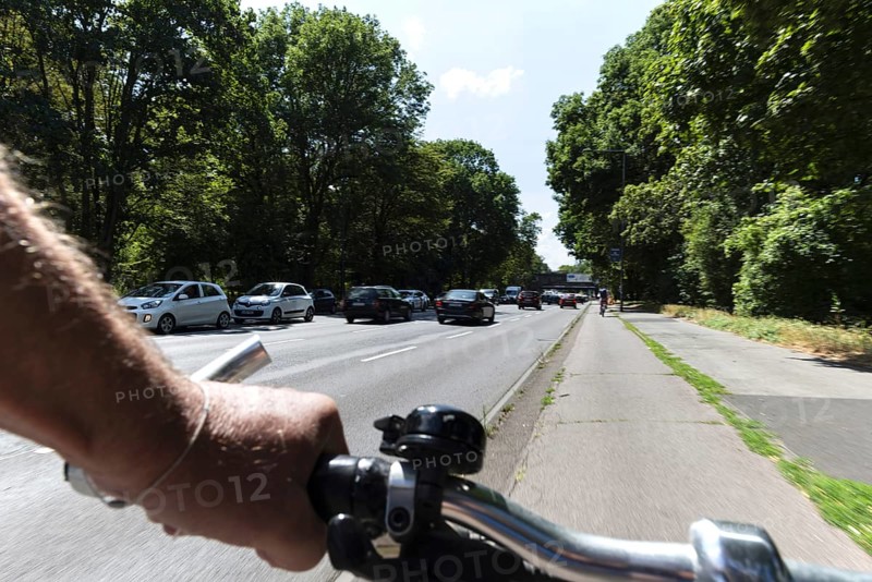 Cycling from a first-person perspective on a cycle path in Cologne, North Rhine-Westphalia, Germany, Europe