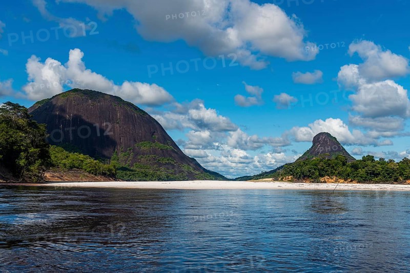 White sand beach before the granite hills of Cerros de Mavecure, Eastern Colombia