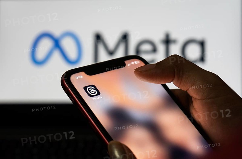 Guwahati, India. 6 July 2023. In this photo illustration, a person browsing the app Threads from Meta, on a mobile phone. Threads is the latest app launched by Meta, and a direct rival of social network Twitter