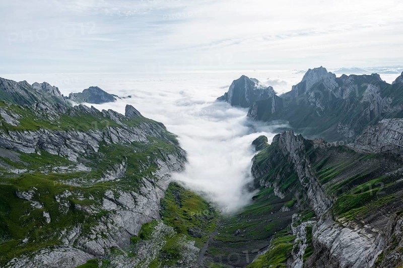 View of mountain peaks above the sea of clouds, Säntis mountains and valley of Meglisalp, high fog, Appenzell Ausserrhoden, Appenzell Alps, Switzerland, Europe