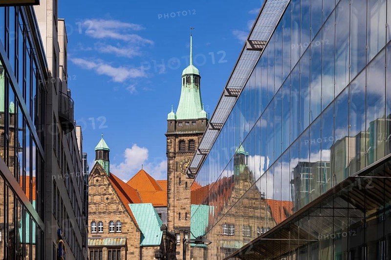 View through Bretgasse to the town hall with the reflection in Galeria Kaufhof
