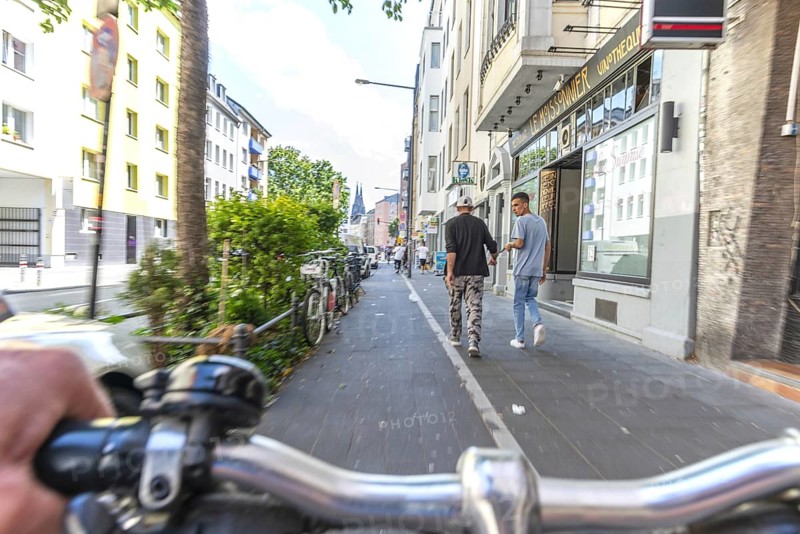 Cycling from a first-person perspective on a cycle path in Cologne, North Rhine-Westphalia, Germany, Europe