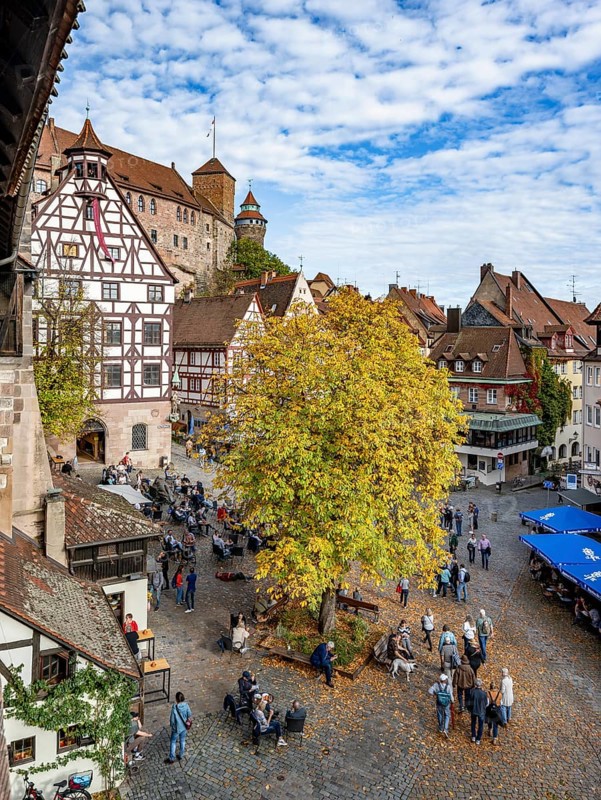 Square at the Tiergärtnertor with half-timbered houses, Pilatus House, at the Kaiserburg, in autumn, Old Town, Nuremberg, Middle Franconia, Bavaria, Germany, Europe
