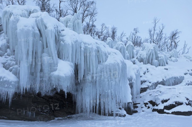 Icicles on the shore of Lake Torneträsk, Lapland, Sweden, Europe