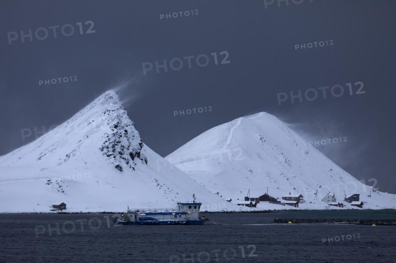 Windswept snow-capped mountains on the island of Mageroya, Honningsvag, Norway, Europe