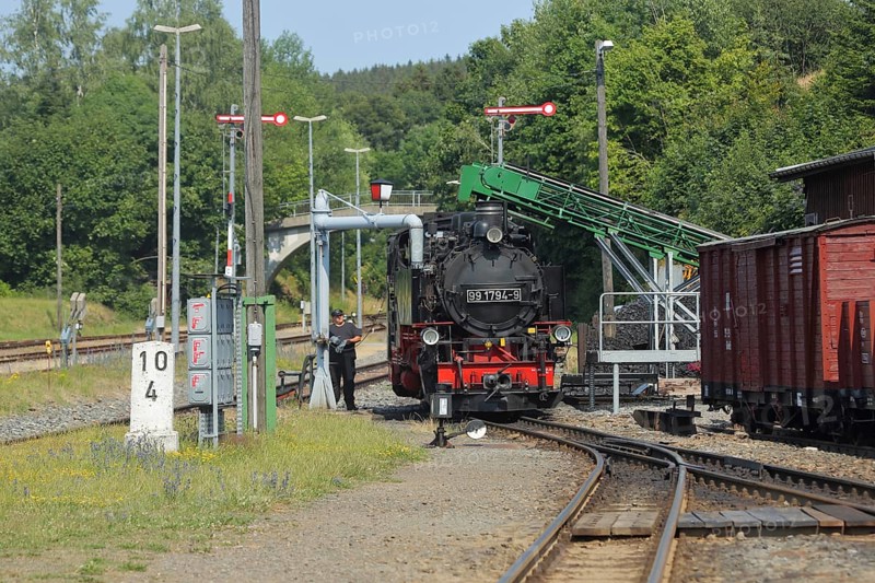 Steam locomotive of the Fichtelbergbahn filling at the water crane, railway tracks, station, Cranzahl, Sehmatal, Erzgebirge, Saxony, Germany, Europe