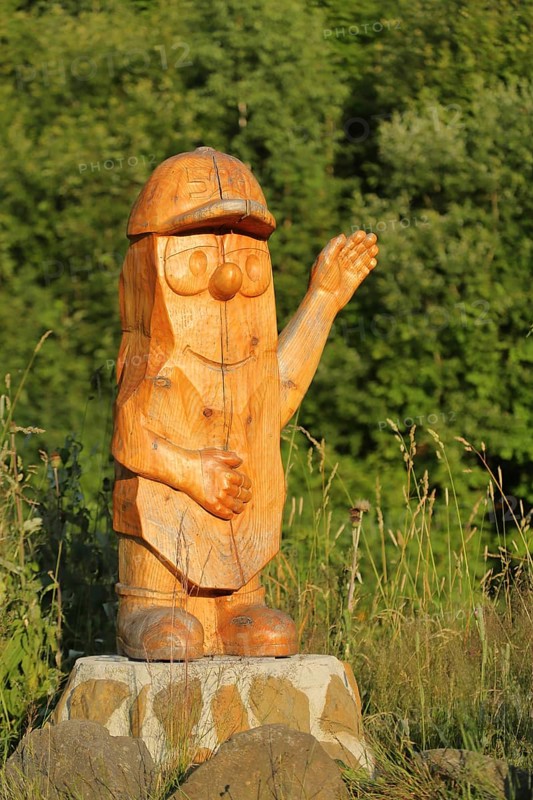 Wood sculpture by chainsaw art, wooden figure, handicraft, wood carving, man, figure, wood, cap, helmet, arm, gesture, high, little man, wave, friendly, greet, organ pipes, Scheibenberg, Middle Erzgebirge, Erzgebirge, Saxony, Germany, Europe