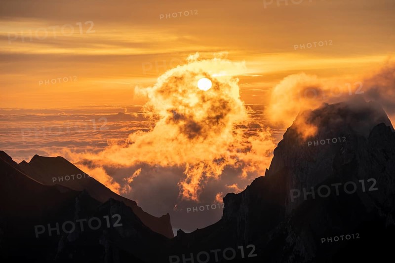 Sunrise, sun shining over mountains in fog, Säntis, Appenzell Ausserrhoden, Appenzell Alps, Switzerland, Europe