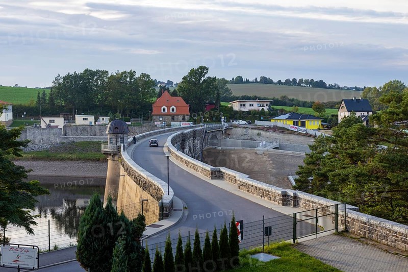 The Malter Dam is a dam built between 1908 and 1913 in the Free State of Saxony near the town of Malter, which impounds the Red Weisseritz in its middle course. The dam is a curved gravity dam made of quarry stone masonry according to the Intze principle. The local road from Malter to Seifersdorf runs over the dam wall. The Malter dam, which is over 100 years old, has been undergoing renovation since 2015. In the process, the spillway is also being expanded