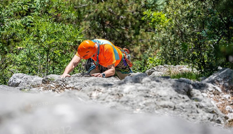 Climber on the rope, multi-pitch climbing, Via la Bellezza della Venere climbing tour, Garda Mountains, Arco, Trentino-Alto Adige, Italy, Europe