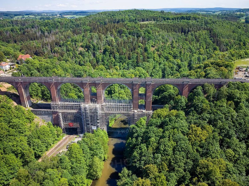 The Elstertalbrücke is a railway bridge in the Vogtland district of Saxony. It carries the Leipzig-Hof railway line near Jocketa over the Weisse Elster and the Gera Süd-Weischlitz railway line running alongside the river. The 68 m high structure is considered the second largest brick bridge in the world after the Göltzschtal Bridge. It will be scaffolded and renovated in 2022