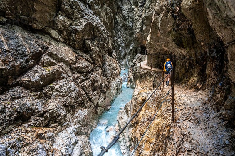 Hiker in a gorge, Hammersbach flows through Höllentalklamm, near Garmisch-Partenkirchen, Werdenfelser Land, Upper Bavaria, Bavaria, Germany, Europe