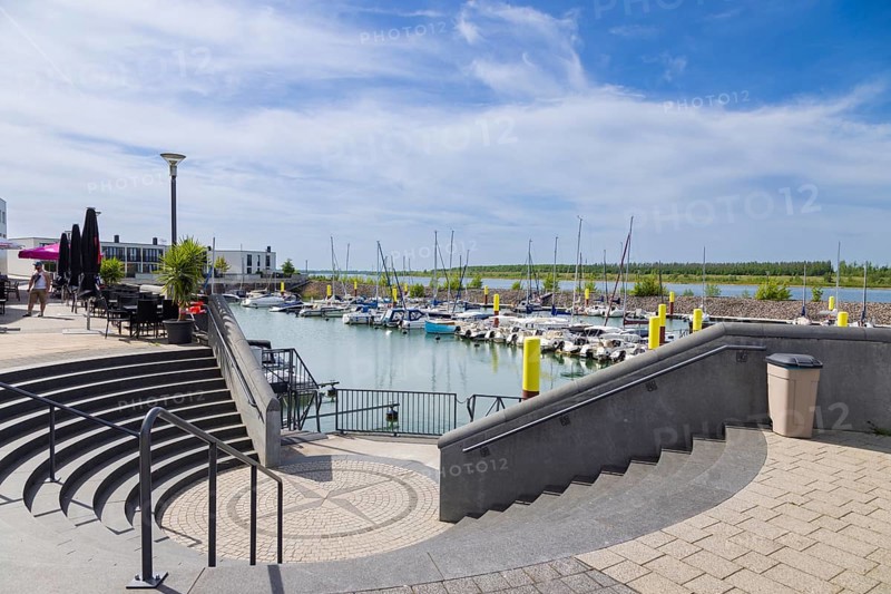 Lake Zwenkau. Lake Zwenkau is currently the last lake from the former open-cast lignite mine in the south of Leipzig that was opened for tourist use in 2015. Harbour facilities with berths, restaurants and holiday apartments
