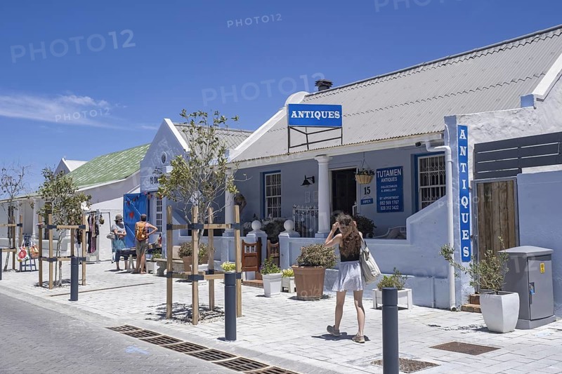 Western tourists at antiques shop in the main street of the town Hermanus, Overstrand, Overberg, Western Cape Province, South Africa, Africa