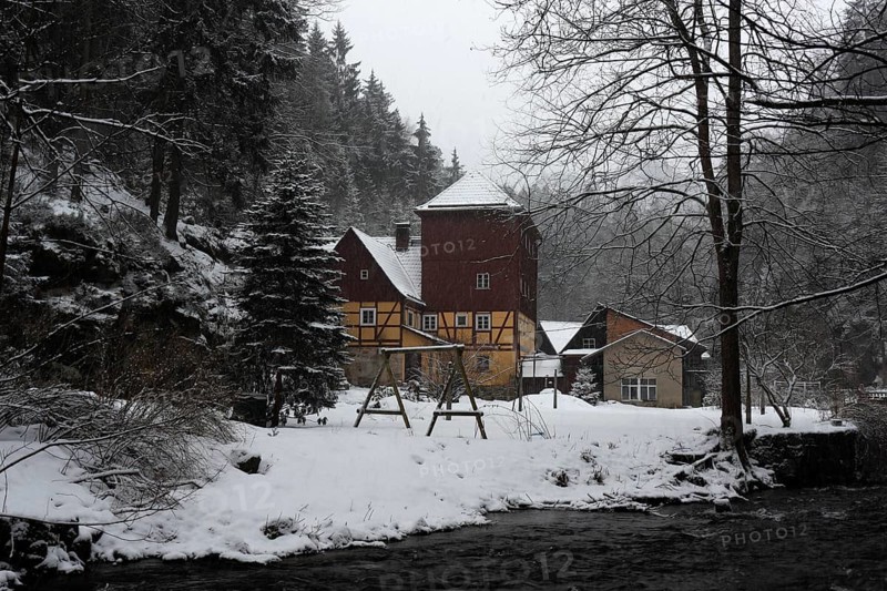 Historic Buschmühle Inn in the Kirnitzsch Valley in winter, Saxon Switzerland, Elbe Sandstone Mountains, Saxony, Germany, Europe