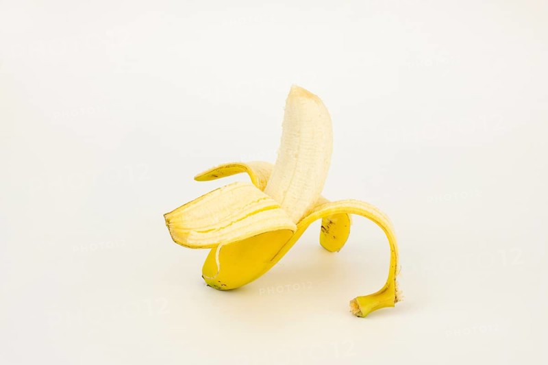 Half peeled banana, studio shot, white background, healthy diet