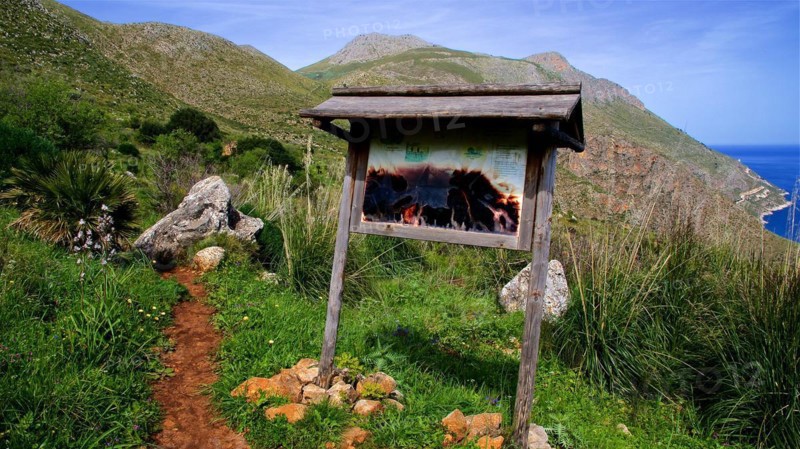 Wooden sign, map, lower part burnt, Zingaro, national park, nature reserve, northwest, Sicily, Italy, Europe