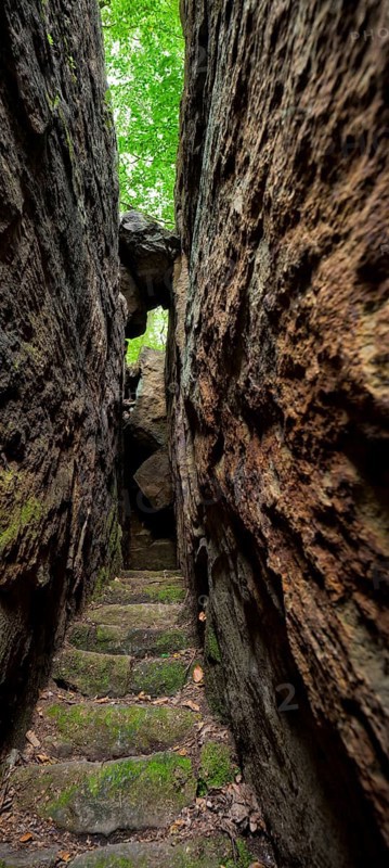 (Copyright Â© Sylvio Dittrich +49 1772156417) Cave at the Langhennersdorfer waterfall in Saxon Switzerland. The waterfall of the same name is located on the Gottleuba valley road not far from Langenhennersdorf. The climb around the waterfall is called the Quarksesteig trail