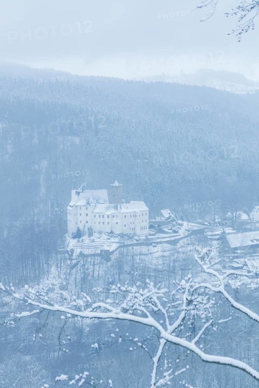 Scharfenstein Castle is a Spornburg on an elongated spur above the village of Scharfenstein