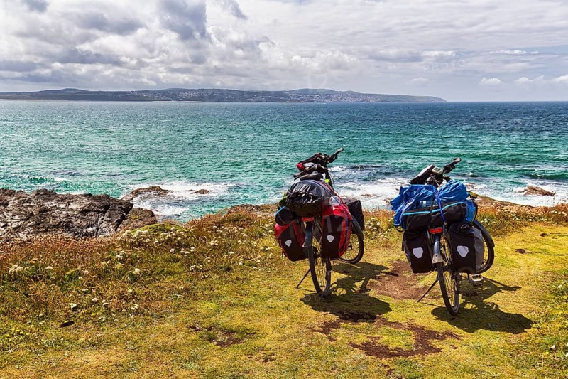 Two e-bikes on the South West Coast Path, coastline, conservation area, National Trust, Gwithian, St Ives Bay, Cornwall, England, United Kingdom, Europe