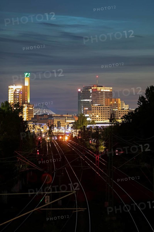 Potsdamer Platz and Sony Center at night and noctilucent clouds (NLC) above, Berlin, Germany, Europe