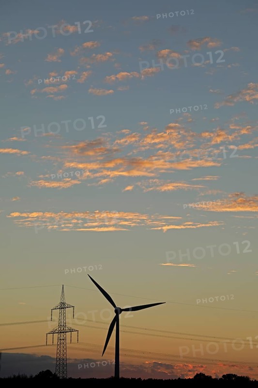 Sunset, wind power station, high voltage pylon, clouds, Melbeck, Ilmenau municipality, Lower Saxony, Germany, Europe