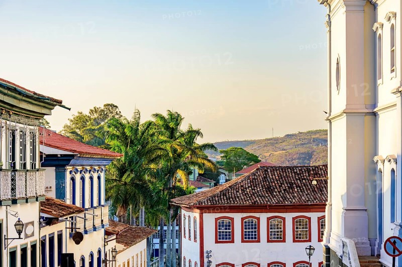 Historic center of the city of Diamantina with its colonial-style houses, hill and palm trees, Brasil