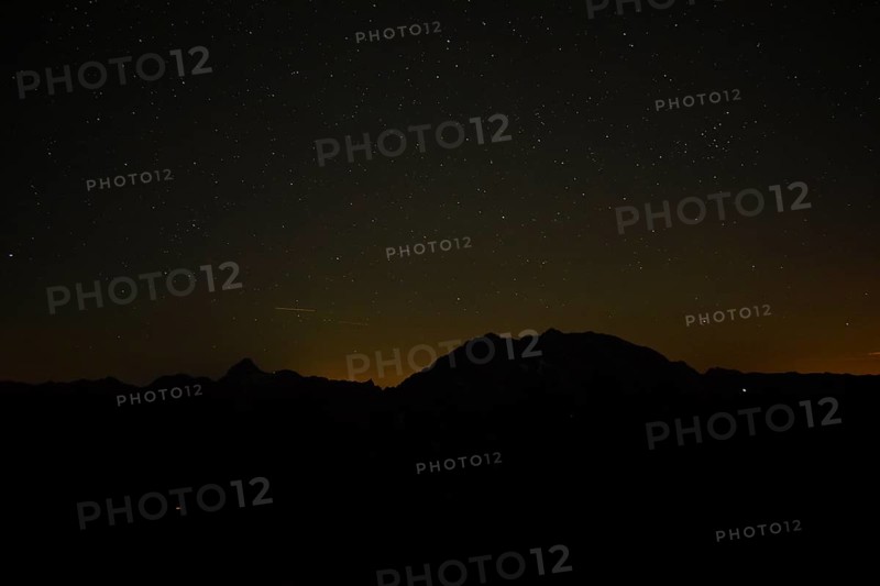 Silhouette of Watzmann and Grosser Hundstod at night in Berchtesgaden National Park, Bavaria, Germany, Europe