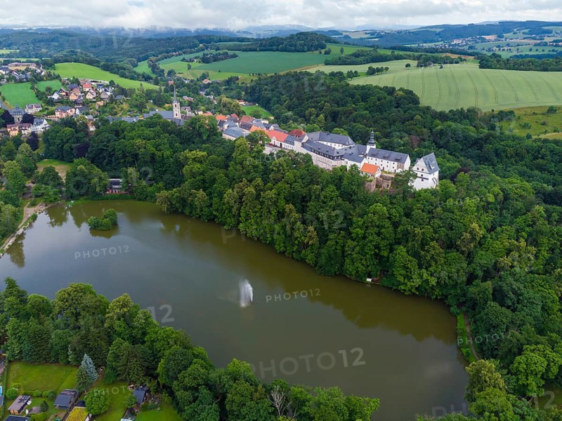 Wildenfels Castle rises on a mountain spur above the town of Wildenfels near Zwickau in Saxony. It is best known for its unique 18th century paper and silk wallpapers, which can be found in the former living quarters of the count's family