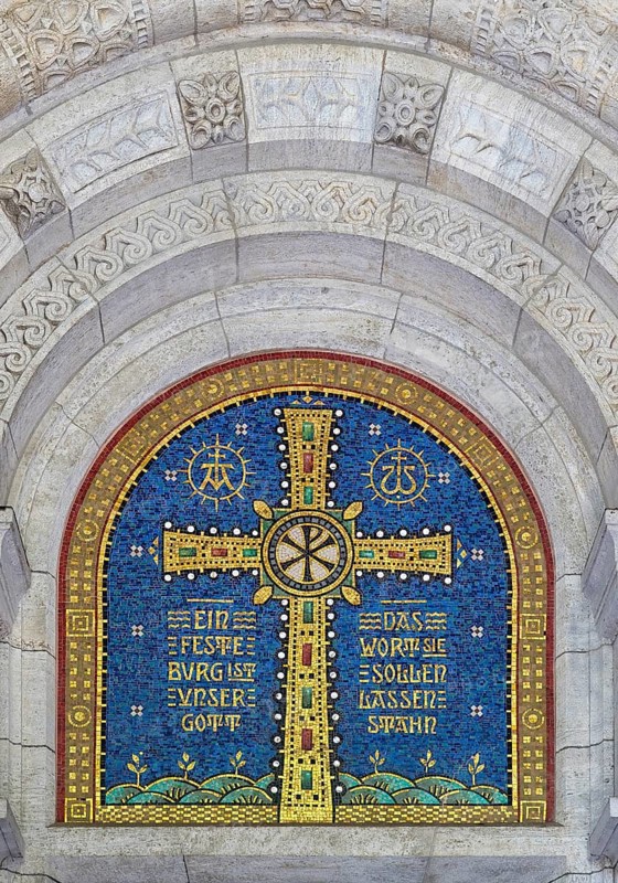 Cross mosaic in the tympanum with the quotation Eine feste Burg ist unser Glauben by Martin Luther, Lutherkirche, Wiesbaden, Hesse, Germany, Europe