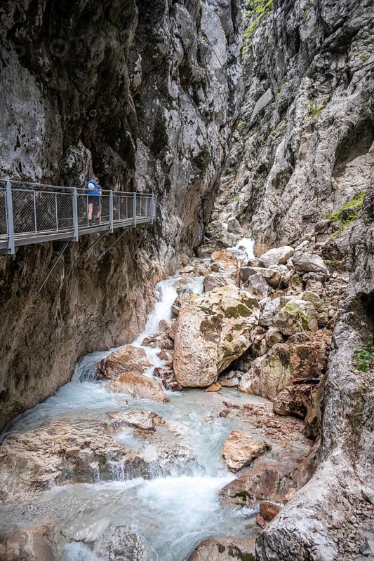 Hiker in a gorge, Hammersbach flows through Höllentalklamm, near Garmisch-Partenkirchen, Werdenfelser Land, Upper Bavaria, Bavaria, Germany, Europe